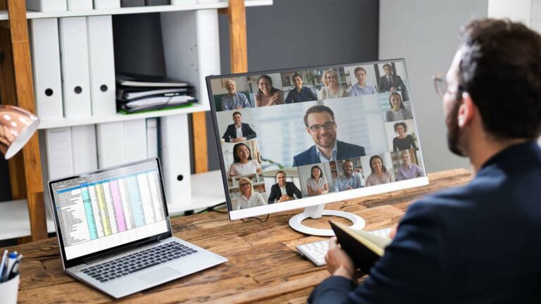Professional on a zoom conference training in his home office