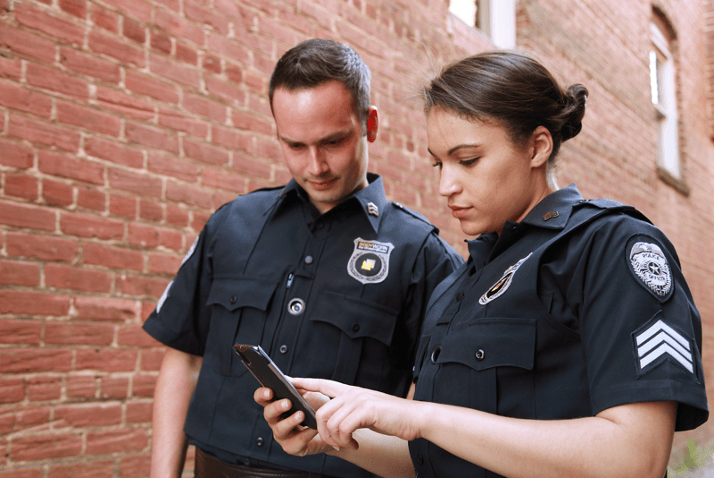 Two security guards analyzing plan for safety