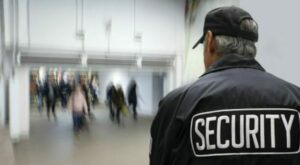 Security guard patrolling school building and grounds