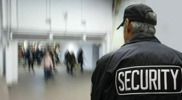 Security guard patrolling school building and grounds
