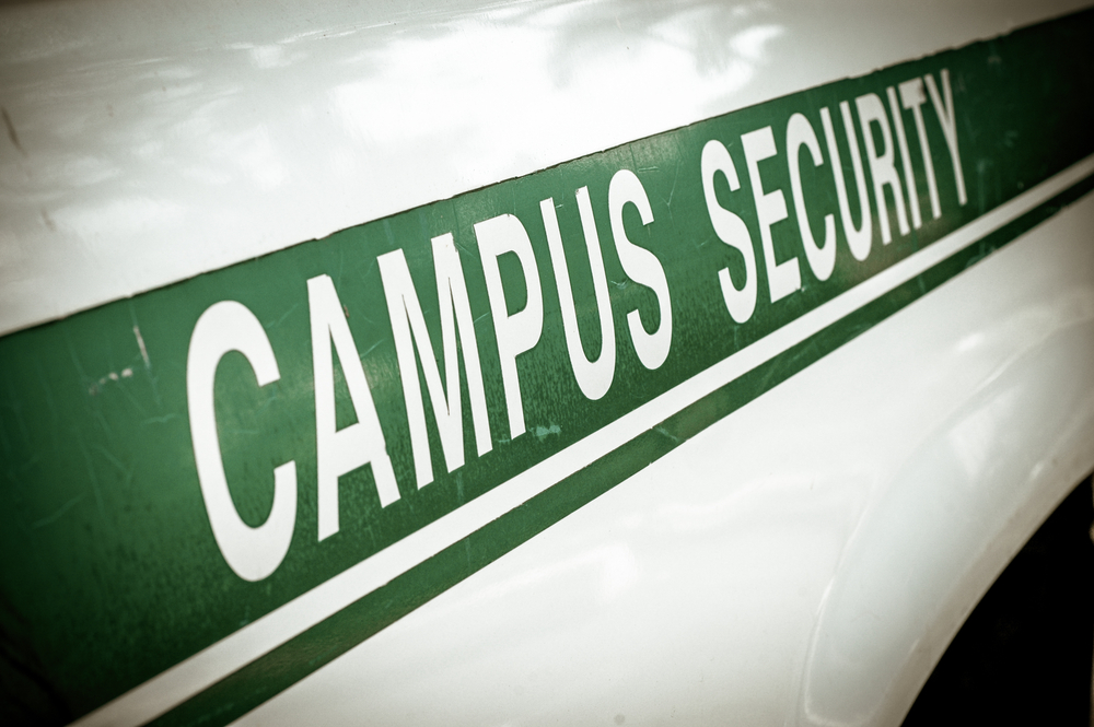Green and white campus security vehicle for colleges