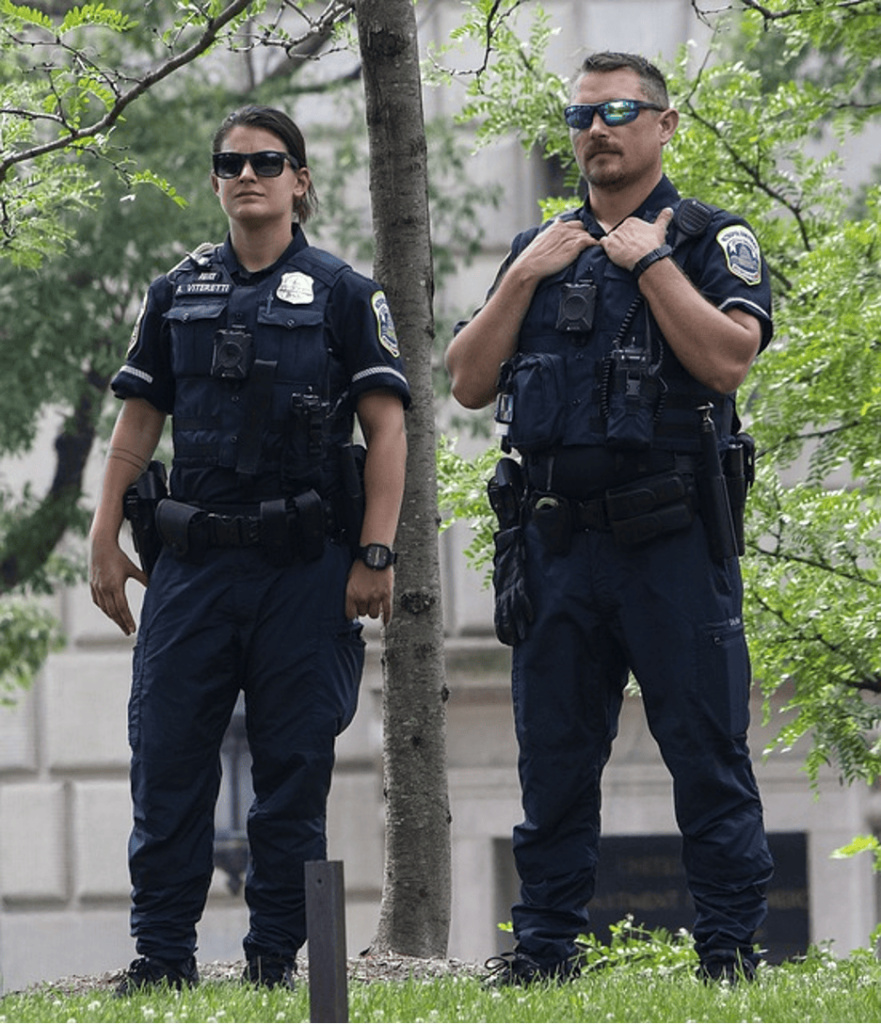 Officers patrolling the area of a campus